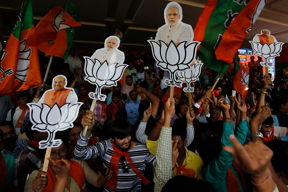 Supporters of BJP celebrate their party’s victory in Gujarat state Assembly elections in Gandhinagar.