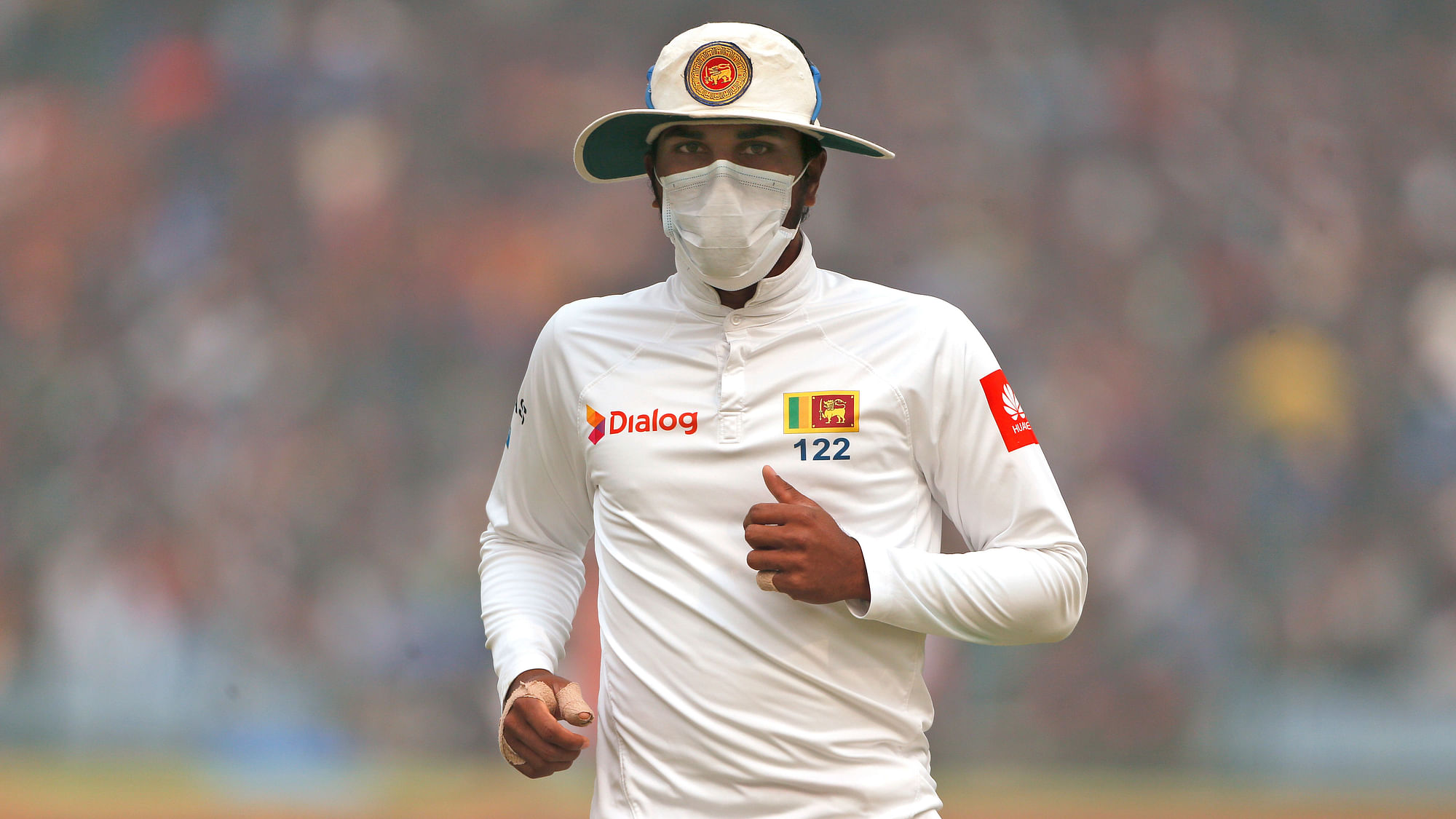 Sri Lankan cricketers were forced to wear masks while fielding.