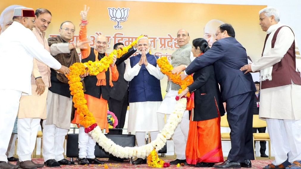 Prime Minister Narendra Modi being felicitated on BJP’s win in Gujarat and Himachal Pradesh Assembly elections, in New Delhi on Monday, 18 December.