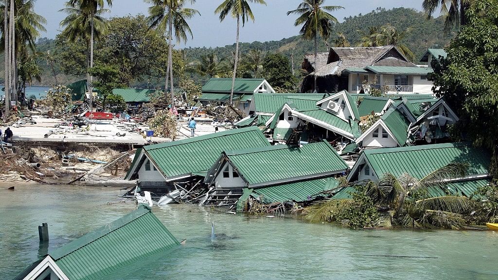 A boat passes by a damaged hotel, at Ton Sai Bay on Phi Phi Island, in Thailand, in late December 2004.