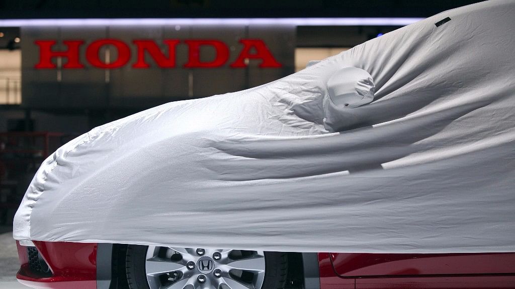 A protective cover sits over a Honda Jazz automobile on the company’s stand, ahead of the opening press day at the Geneva International Motor Show in Geneva.&nbsp;