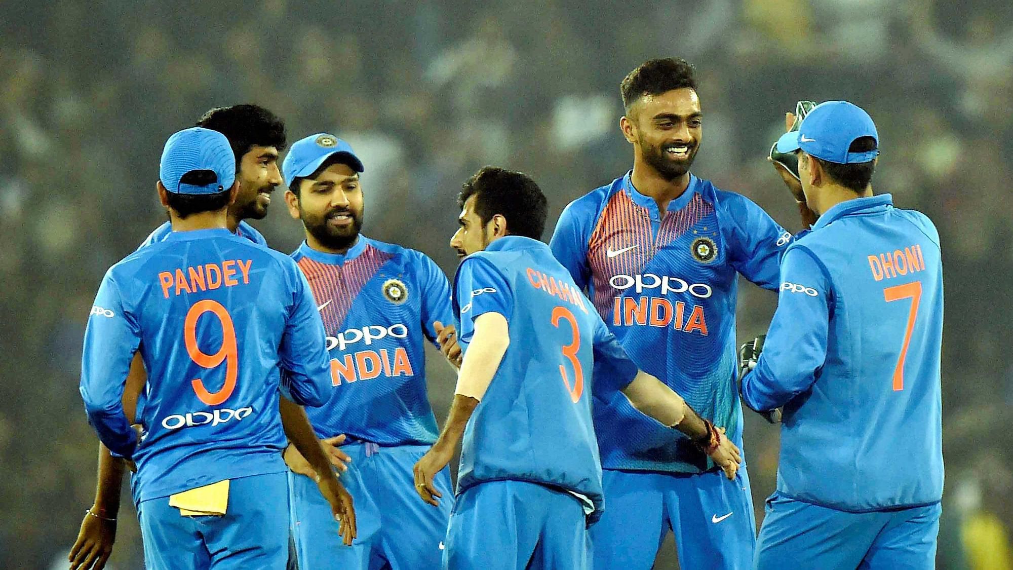 Indian cricketers celebrate the dismissal of a Sri Lankan batsman during the T20 match at Barabati Stadium in Cuttack on Wednesday.&nbsp;