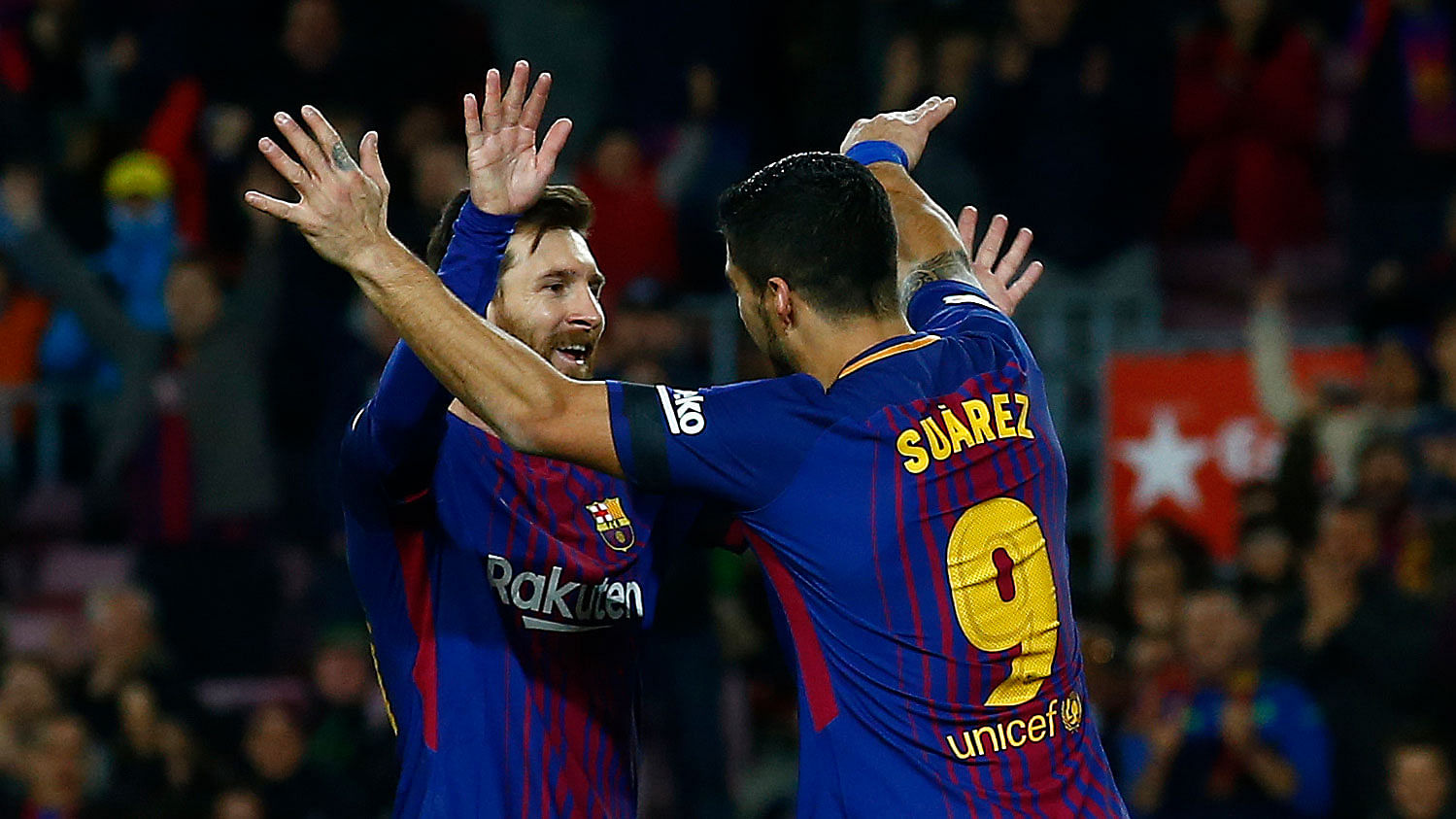Barcelona’s Luis Suarez, second left, celebrates after scoring with his teammate Lionel Messi during the Spanish La Liga match.