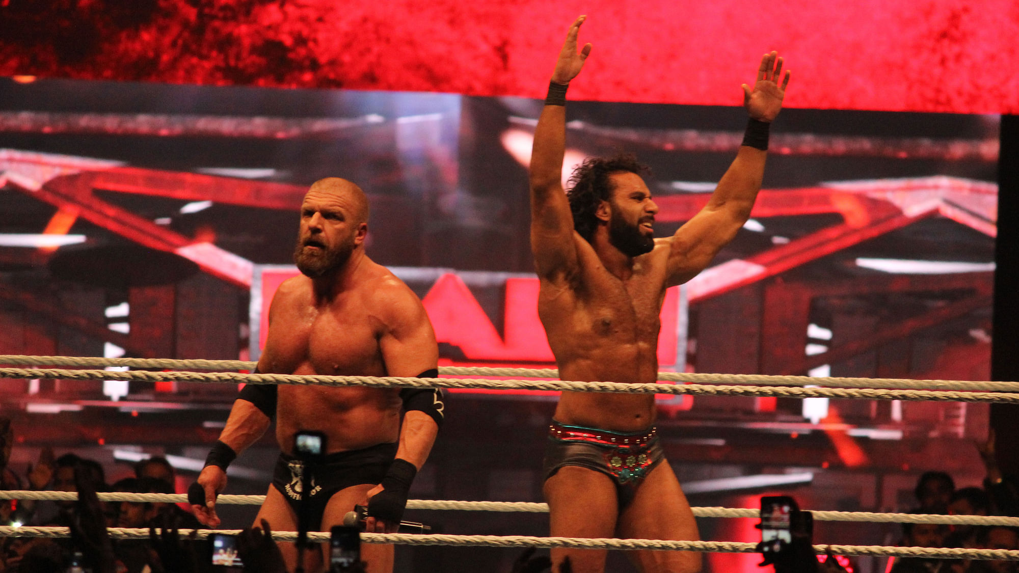 Triple H and Jinder Mahal gesture to the crowd after their fight at the WWE event in New Delhi on Saturday.&nbsp;