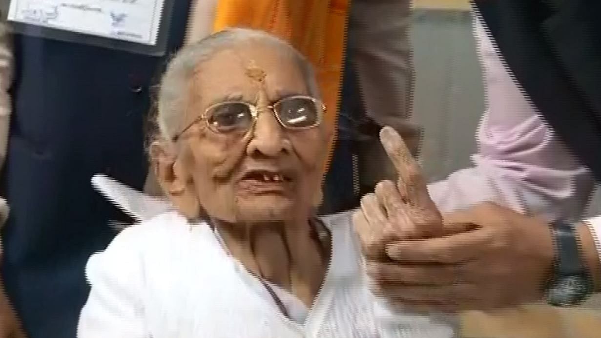 PM Narendra Modi’s mother Heeraben casts her vote in Gandhinagar.