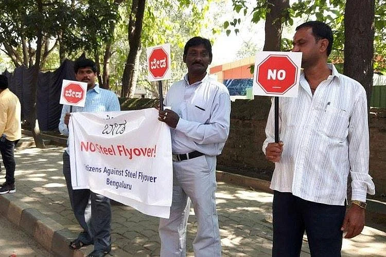 Thousands of people took to the streets to protest against the construction of a steel flyover in Bengaluru. 