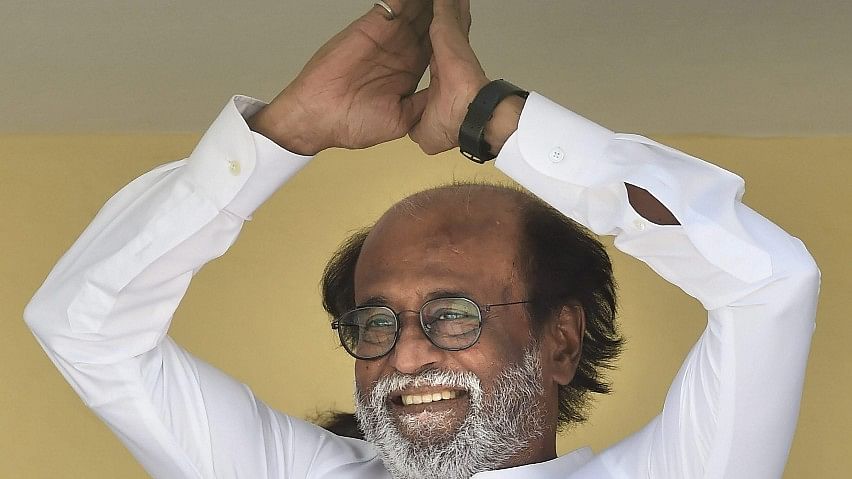 Tamil actor Rajinikanth gestures at his fans after announcing his political debut on the final day of his six-day-long meet with fans, in Chennai on Sunday.&nbsp;