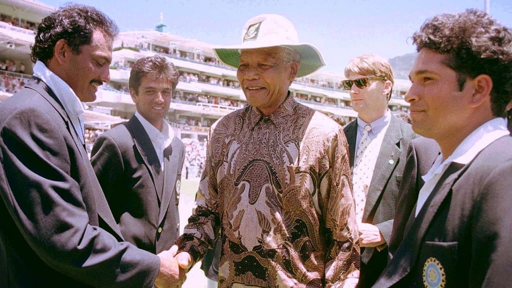 The then South African President Nelson Mandela (C) is introduced to Mohammad Azharuddin (L) by the then Indian captain Sachin Tendulkar (R) in 1997.