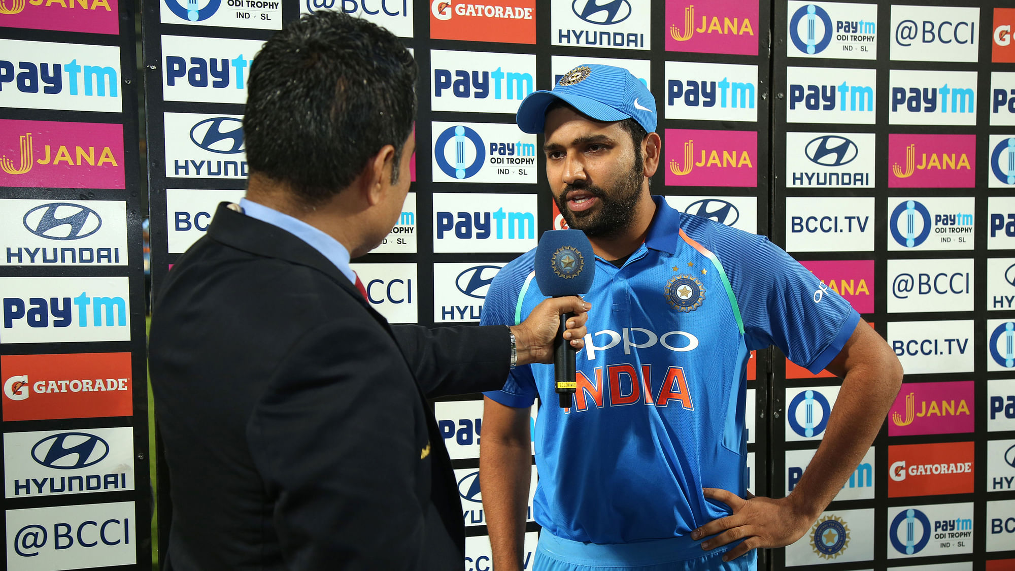 Rohit Sharma speaks to Sanjay Manjrekar at the presentation ceremony.