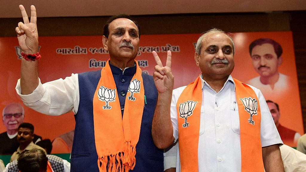 Gujarat Chief Minister Vijay Rupani (left) and deputy Chief Minister Nitin Patel.