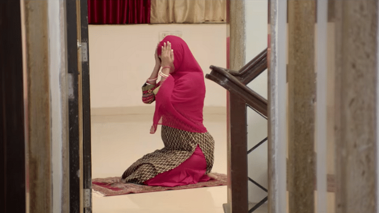 A Muslim woman offers <i>Namaz</i> in the film <i>Game of Ayodhya</i>.