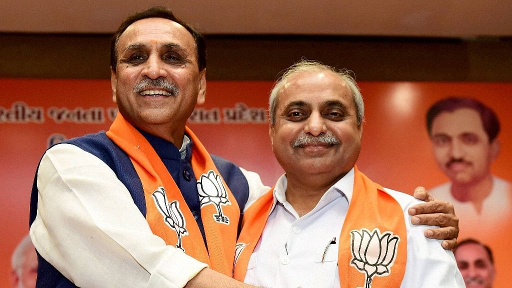 Gujarat Chief Minister Vijay Rupani and his deputy Nitin Patel retained their posts after the BJP won the Gujarat assembly polls.