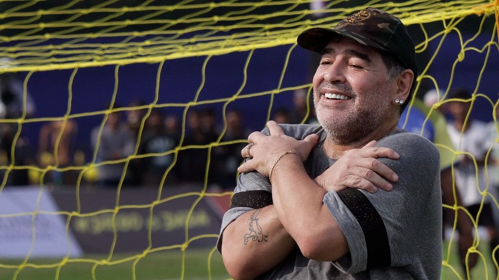 Diego Maradona, gestures to media as he attends a football clinic and workshop for young aspiring soccer players in Kadambagachhi, about 45 kilometers (28 miles) north of Kolkata, on 12 December 2017.