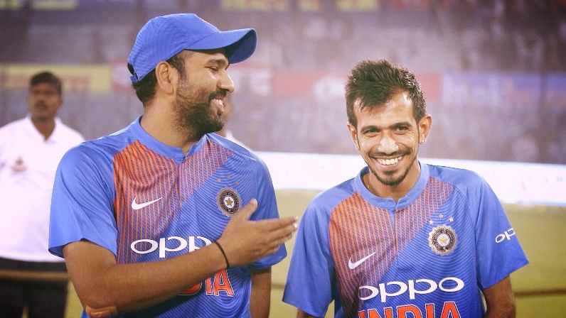 Rohit Sharma and Yuzvendra Chahal share a light moment after the first T20 against Sri Lanka.