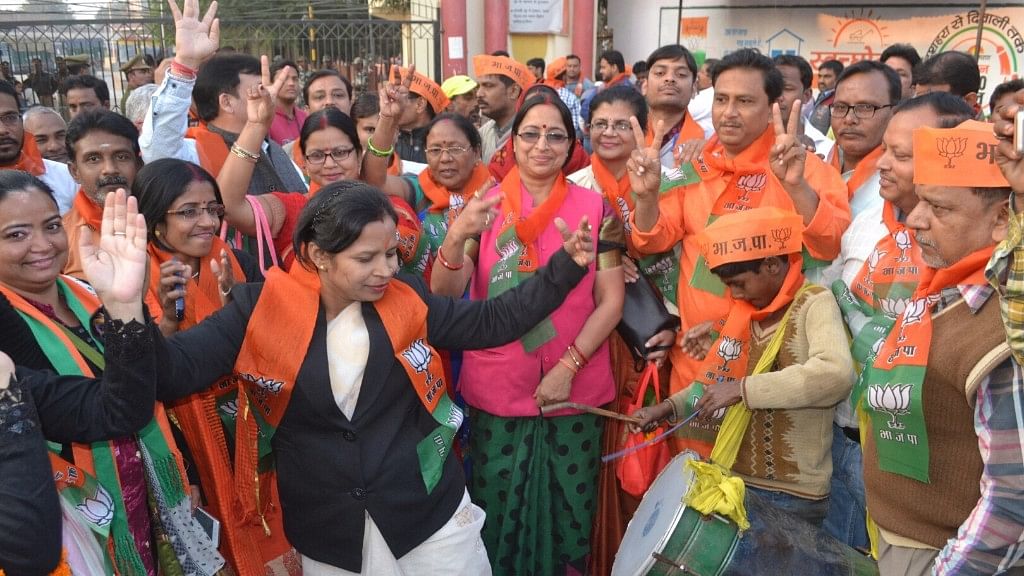 BJP workers dance as their party secures a victory in the UP civic polls.&nbsp;