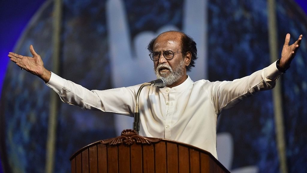 Tamil actor Rajinikanth gestures while announcing his political entry.