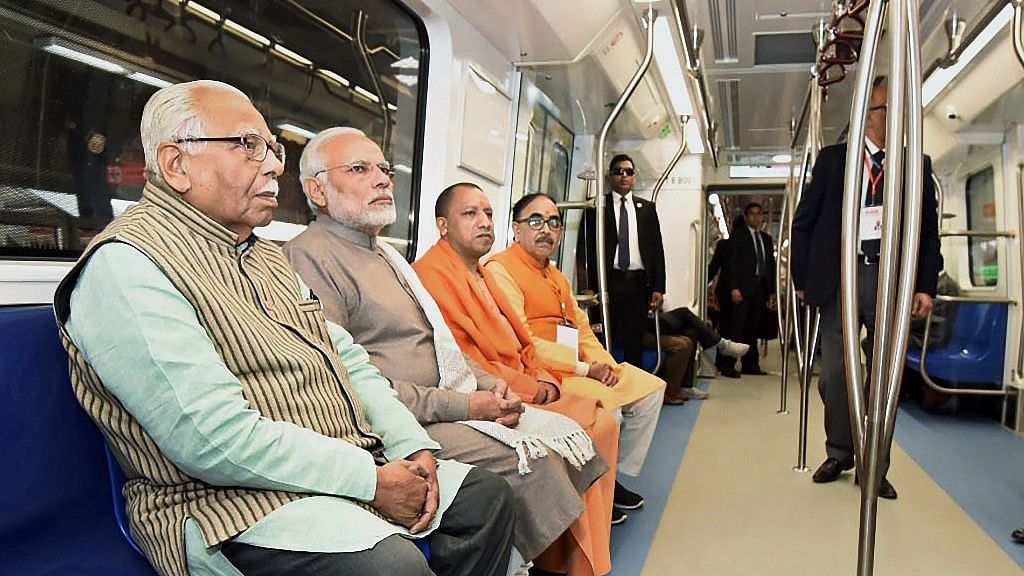 PM Modi takes a ride in a Metro from Botanical Garden Station to Okhla Bird Sanctuary along with UP Chief Minister Yogi Adityanath.