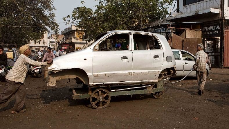 This is a representational image of a Santro car being towed away.
