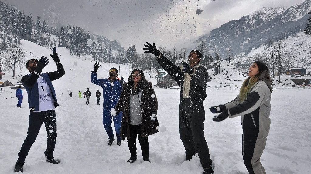 Tourists enjoying with snow after a fresh snowfall in Manali