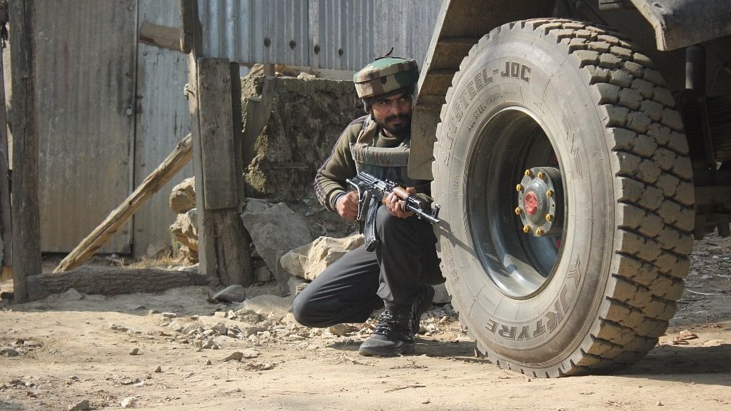 A soldier takes position during an encounter with terrorists in Budgam of Jammu and Kashmir on 30 November 2017. 
