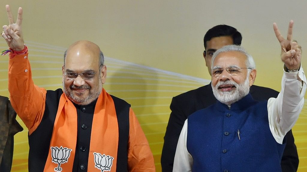 Prime Minister Narendra Modi and BJP President Amit Shah flash victory signs. File Image.
