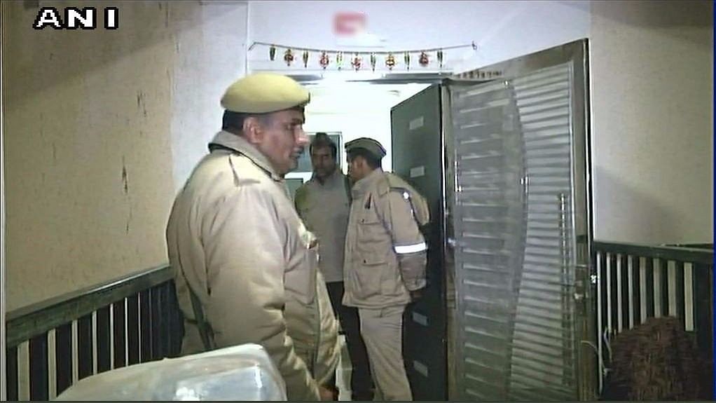 Police in front of the Greater Noida flat where the incident occurred.&nbsp;