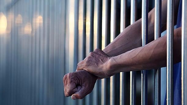 Representational image of prisoner behind bars.&nbsp;