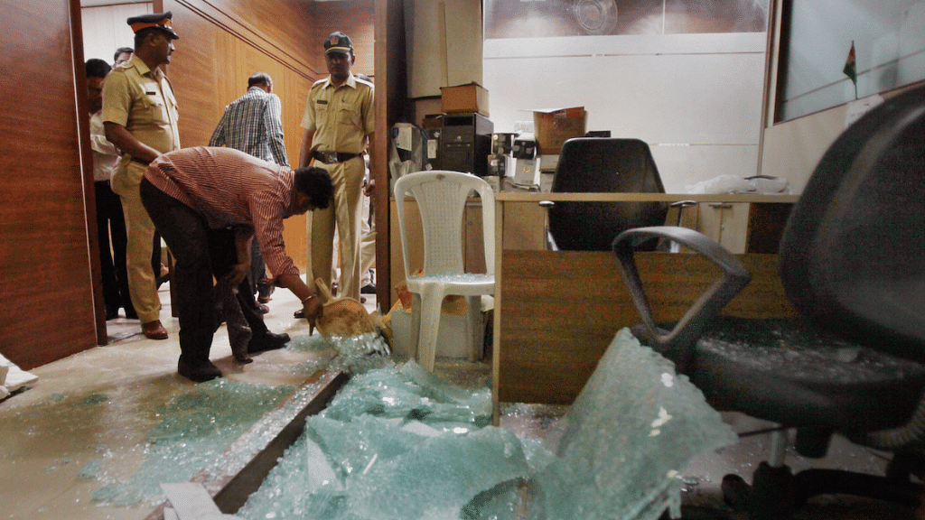 Police inspecting the Congress’ office in Mumbai on Friday, 1 December, after it was ransacked by unknown miscreants.