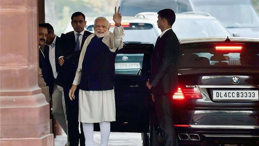 Narendra Modi flashes victory sign after BJP’s success in Himachal and Gujarat assembly elections, on his arrival for the winter session of Parliament, in New Delhi on Monday.