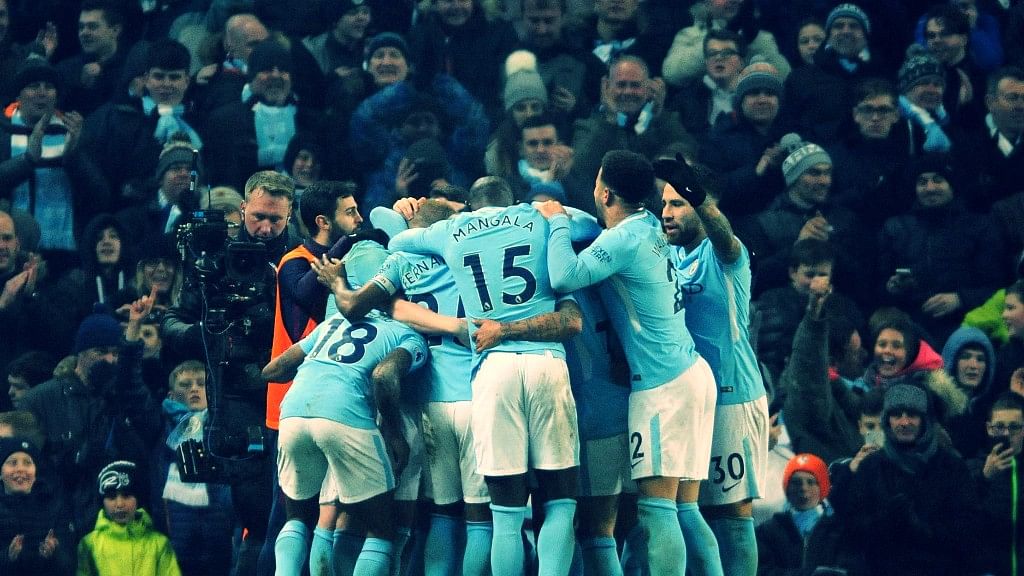 Manchester City players celebrate their team’s third goal during the English Premier League soccer match between Manchester City and Tottenham Hotspur.
