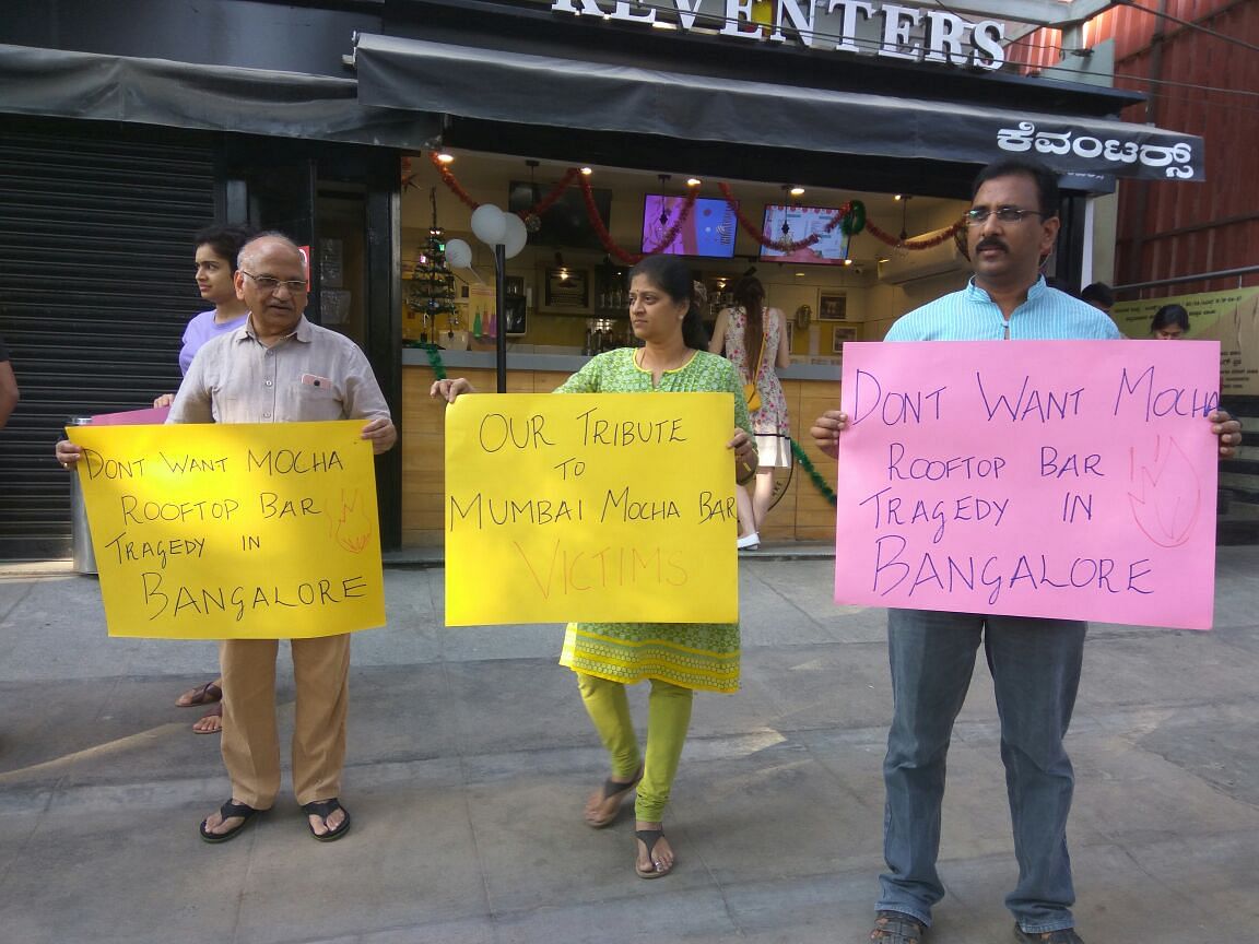 Members of I Change Indiranagar protest against high-rise buildings violating rules.