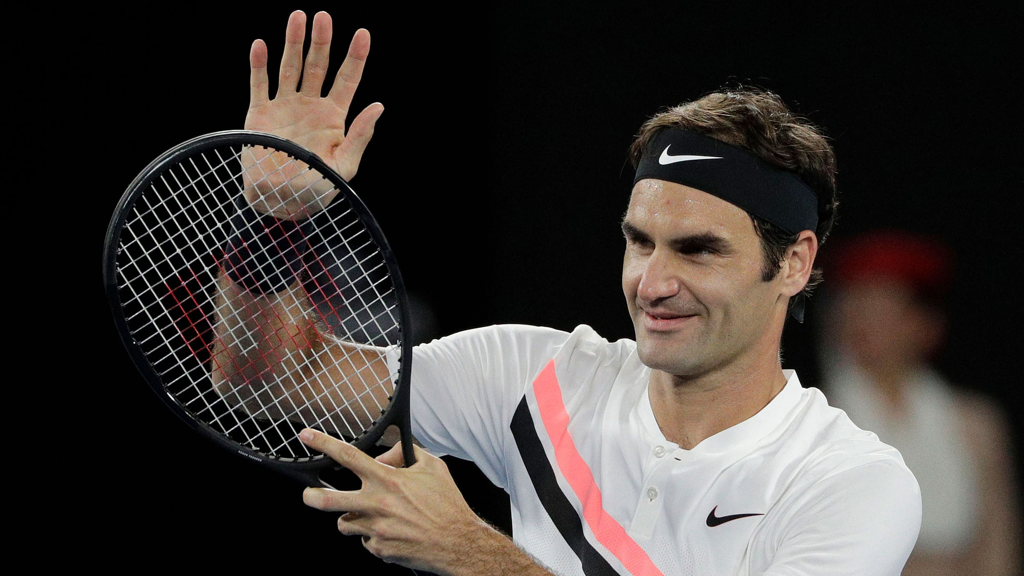 Roger Federer gestures to the crowd after defeating Tomas Berdych in the quarter-final of the Australian Open.