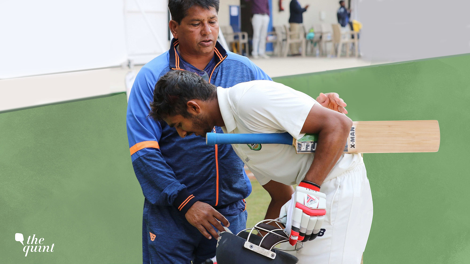 Vidarbha’s Akshay Wadkar touches coach Chandrakant Pandit’s feet after scoring a century during the Ranji Trophy final.