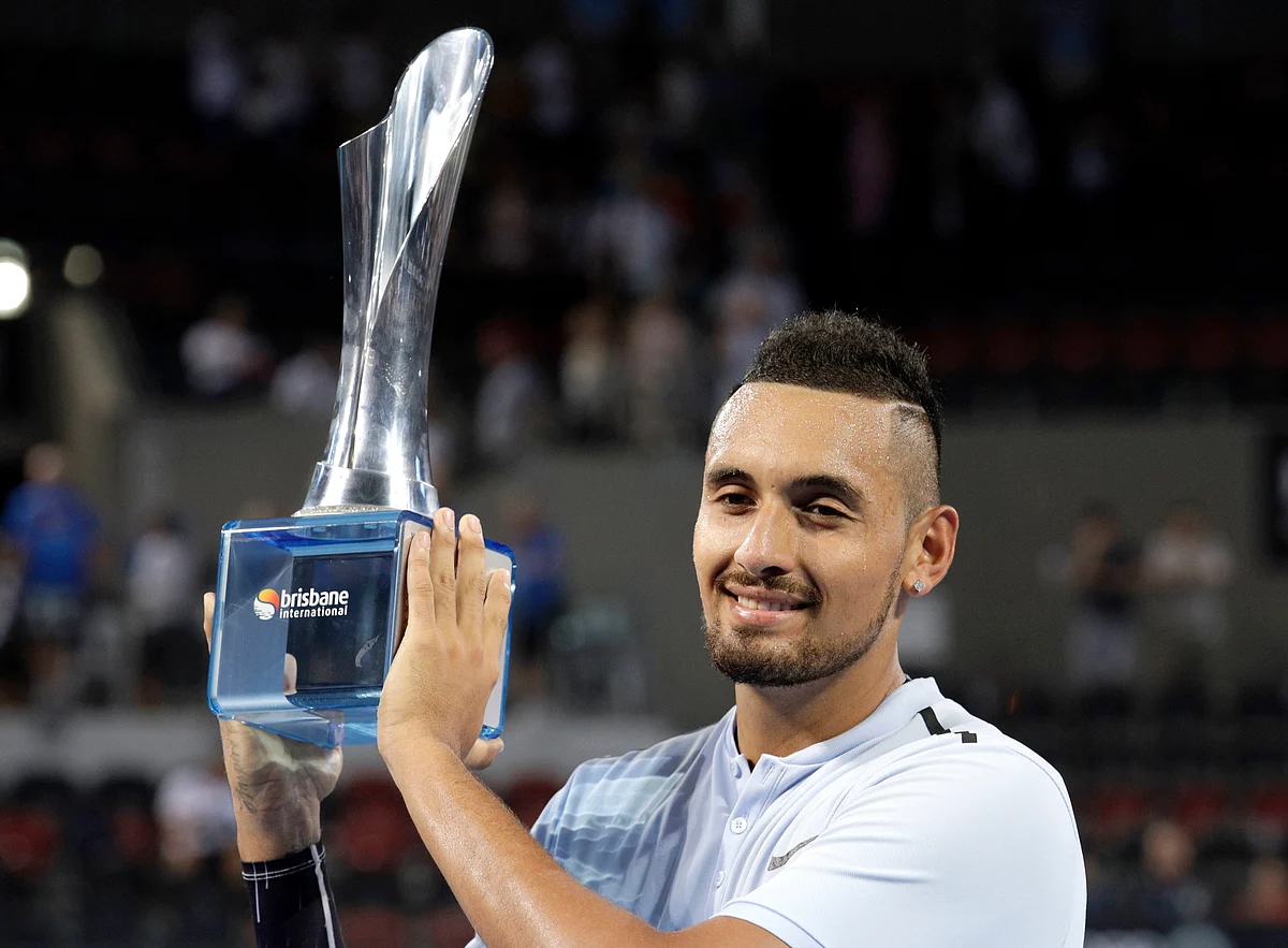 In this Sunday, Jan. 7, 2018 file photo Nick Kyrgios of Australia holds his trophy after winning his final match against Ryan Harrison of the U.S. 6-4, 6-2, at the Brisbane International tennis tournament in Brisbane, Australia.