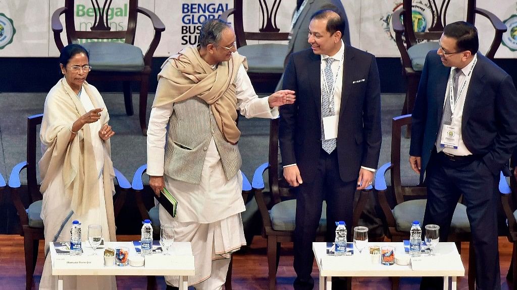 West Bengal CM Mamata Banerjee, Finance Minister Amit Mitra, Pranav Adani Managing Director, Adani Wilmar and Chairman of RP Sanjiv Goenka Group Sanjeev Goenka at Bengal Global Business Summit 2018, in Kolkata, on Wednesday.&nbsp;