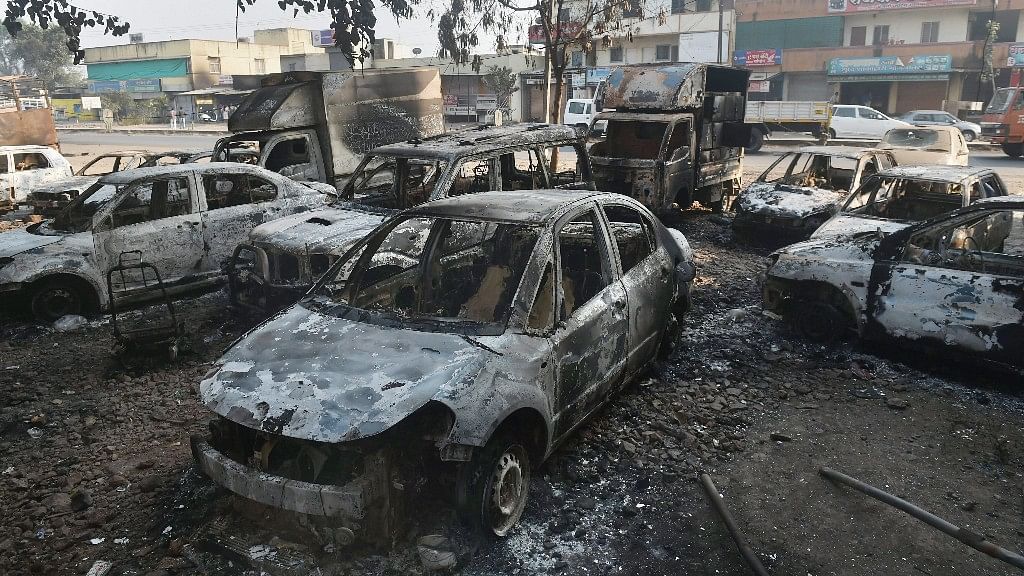Charred vehicles seen following the violence that erupted during the 200th anniversary celebration of the Battle of Koregaon in Pune.