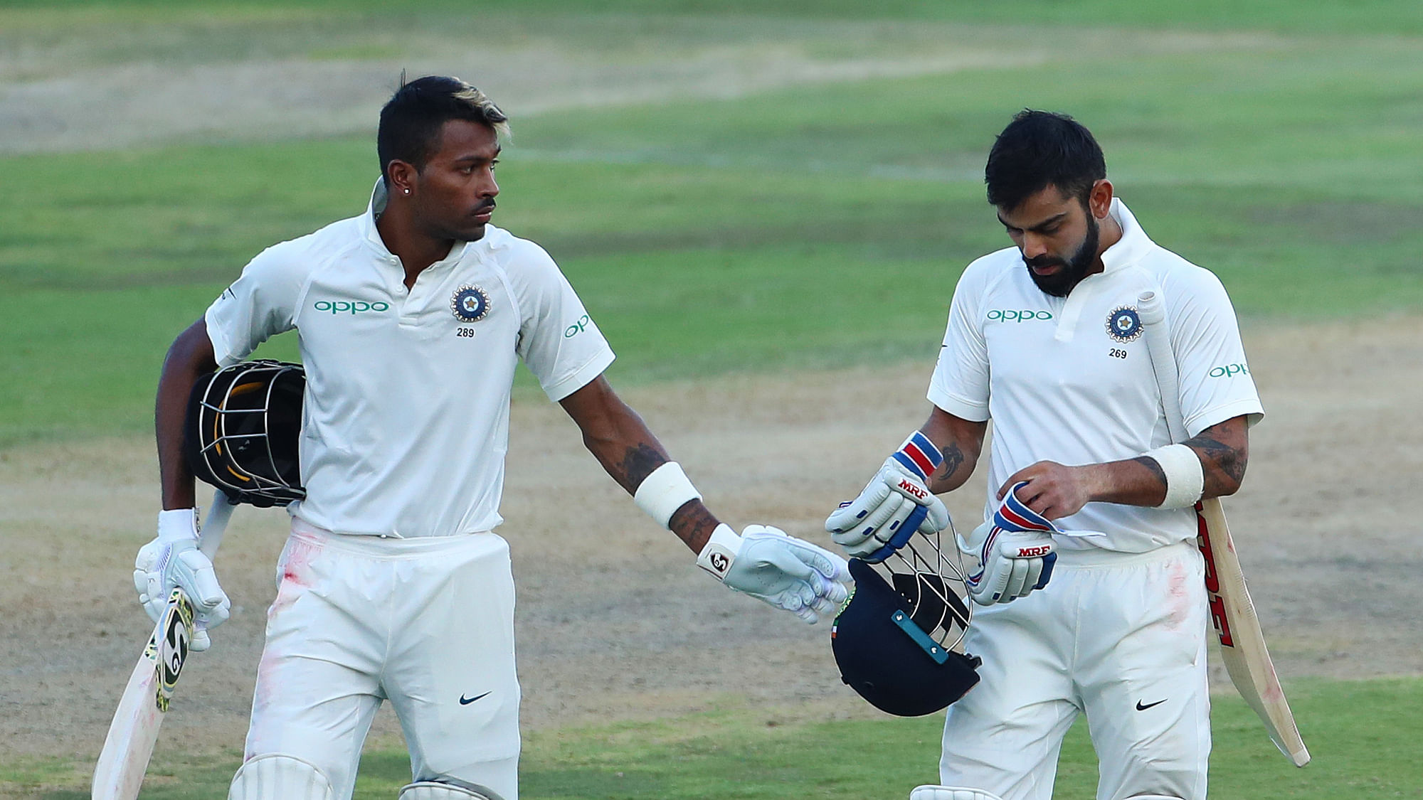 Hardik Pandya of India and Virat Kohli (captain) of India leave the field at the end of play.&nbsp;