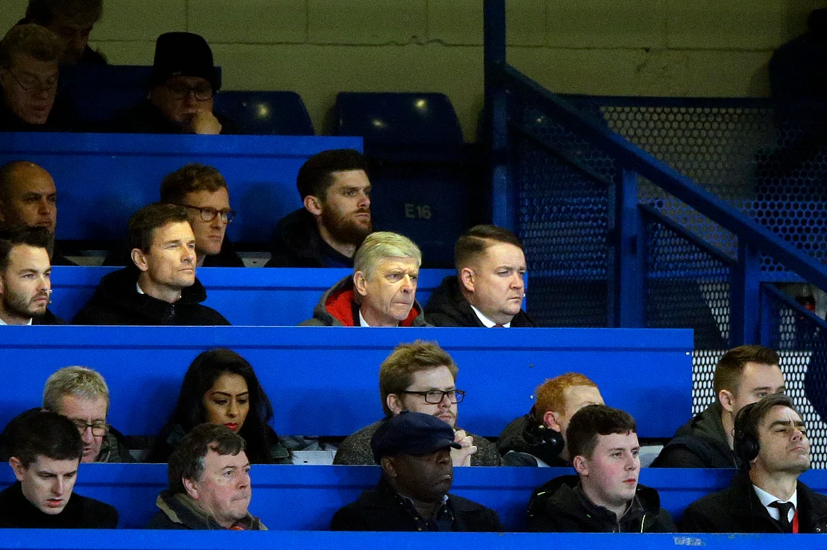 Arsenal manager Arsene Wenger looks out from the press box during the English League Cup semifinal at Stamford Bridge stadium.
