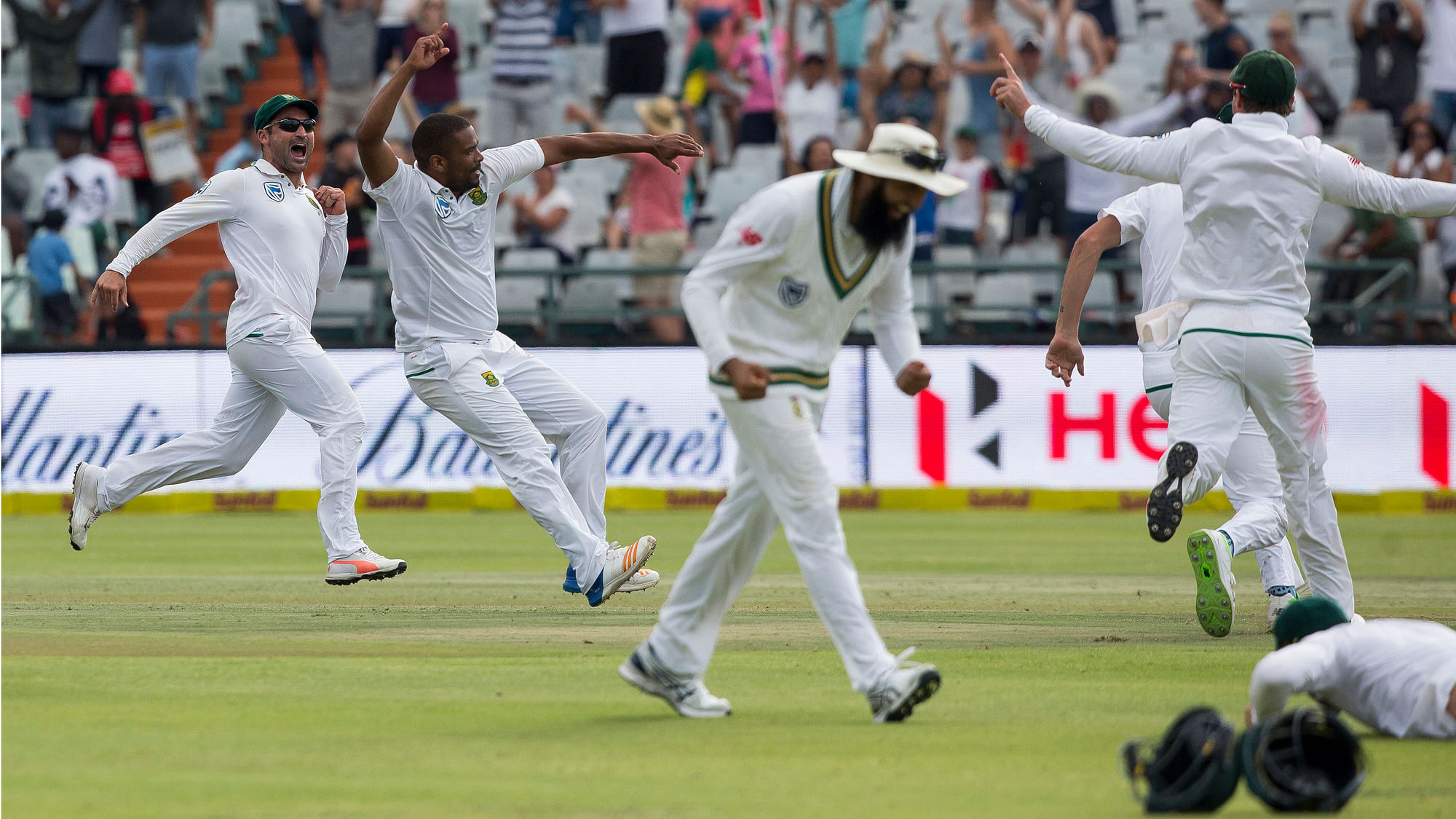 Jubilant South African players celebrate after their victory against India in Cape Town.