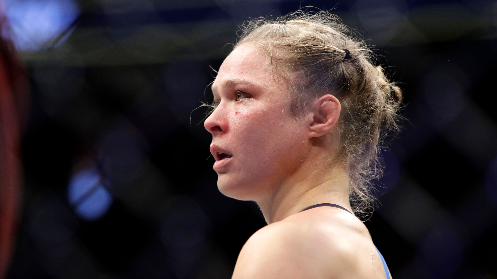 In this Dec. 30, 2016, file photo Ronda Rousey stands in the cage after Amanda Nunes forced a stoppage in the first round of their women’s bantamweight championship mixed martial arts bout at UFC 207 in Las Vegas. Rousey’s next fight could come in a WWE ring.