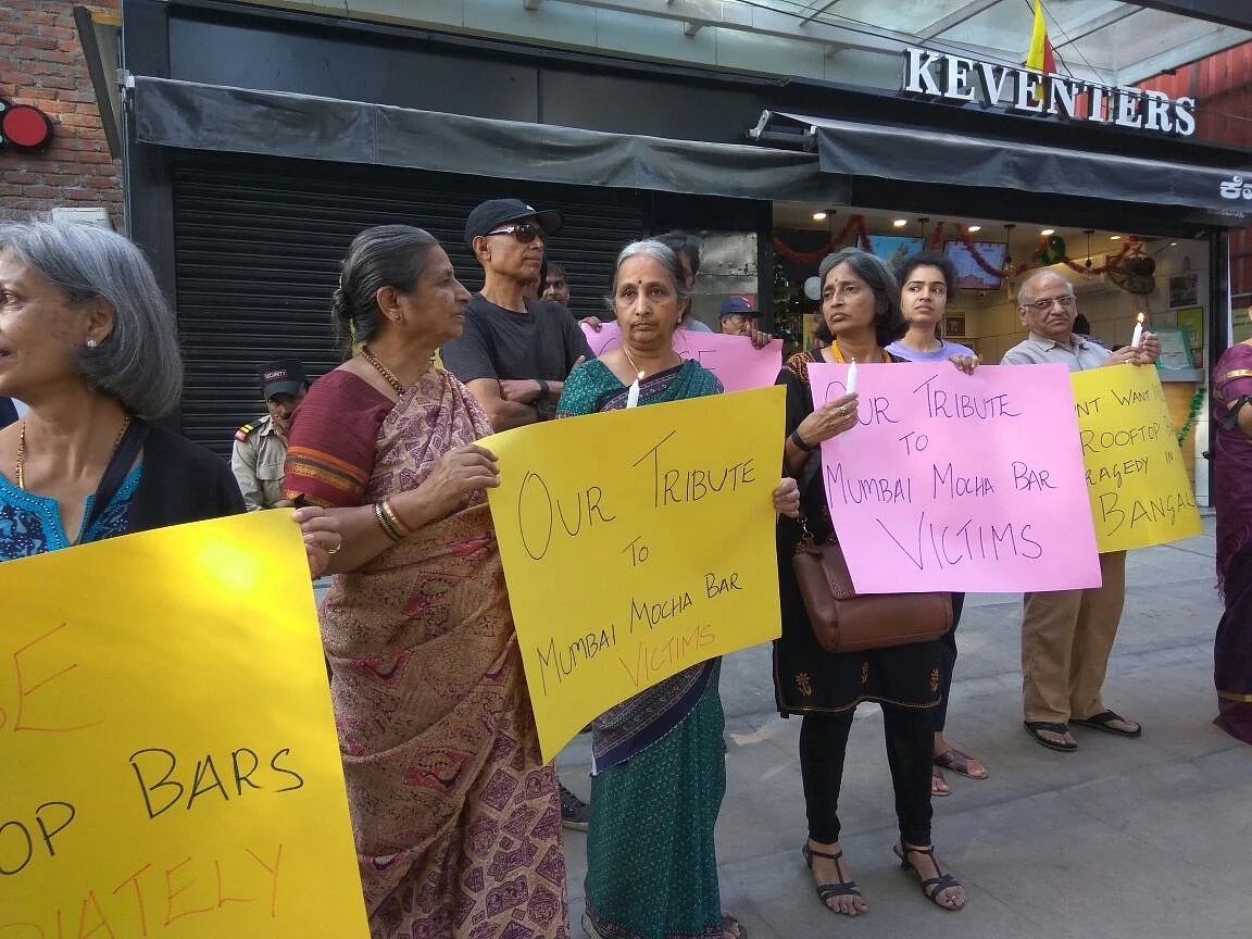 Members of I Change Indiranagar protest against high-rise buildings violating rules.