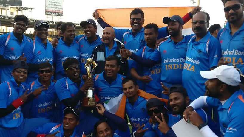 The Indian team pose with the Blind Cricket World Cup.