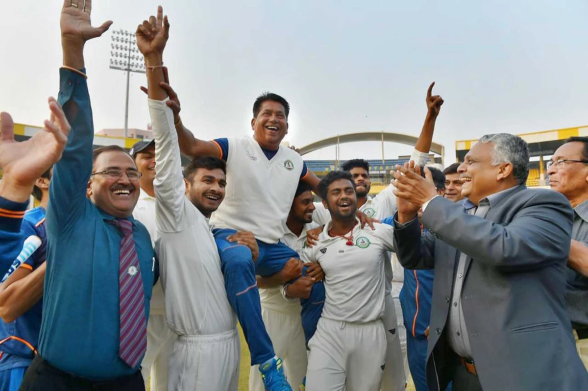 Jubilant Vidarbha team celebrating Ranji Trophy win with their coach Chandrakant Pandit.