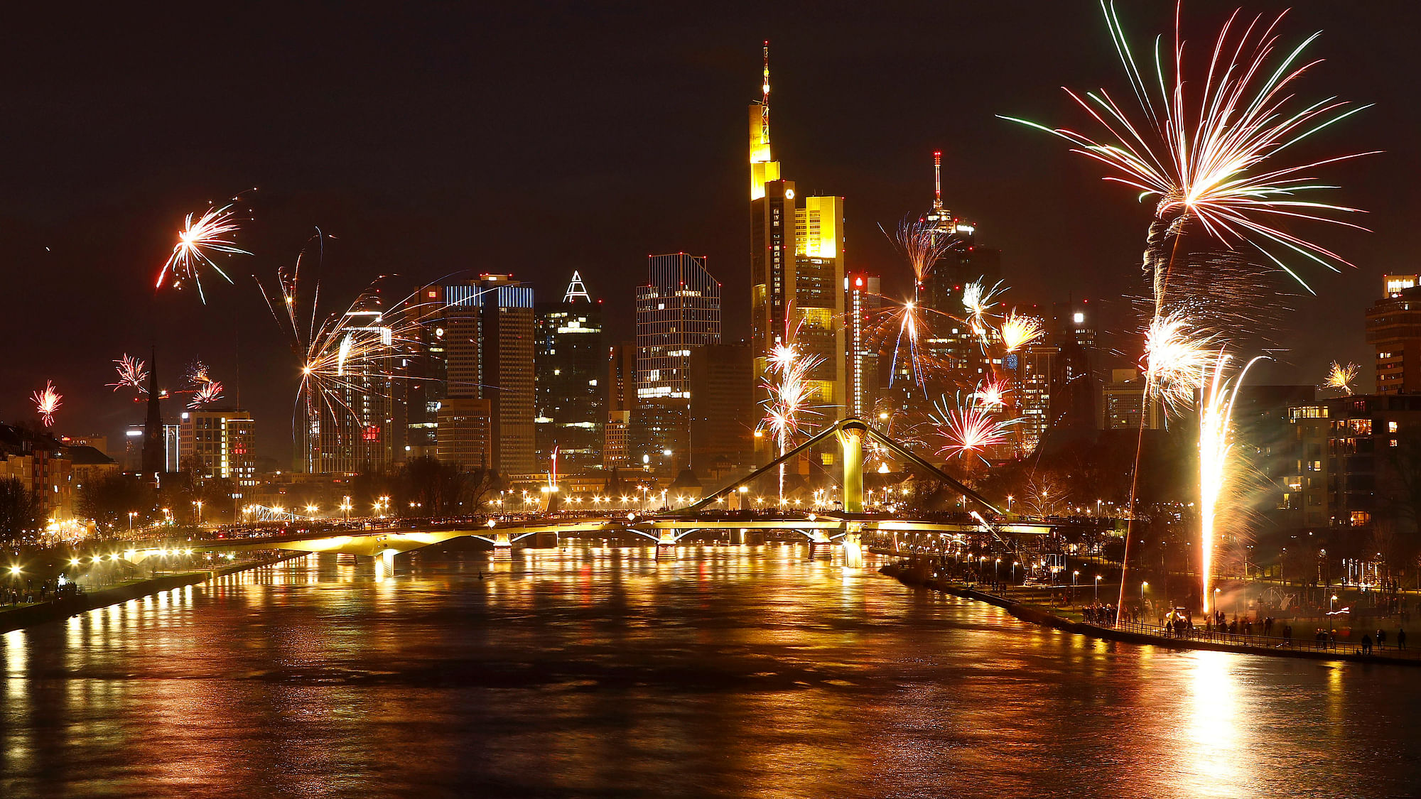 Fireworks explode in front of the skyline with the financial district during New Year’s eve celebrations in Frankfurt, Germany.