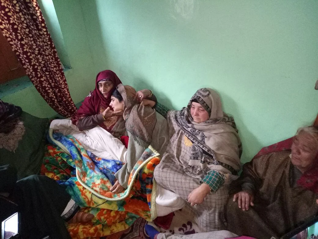 Mannan Wani’s sister (second from left) mourning the news of her brother joining the Hizbul Mujahidden group.