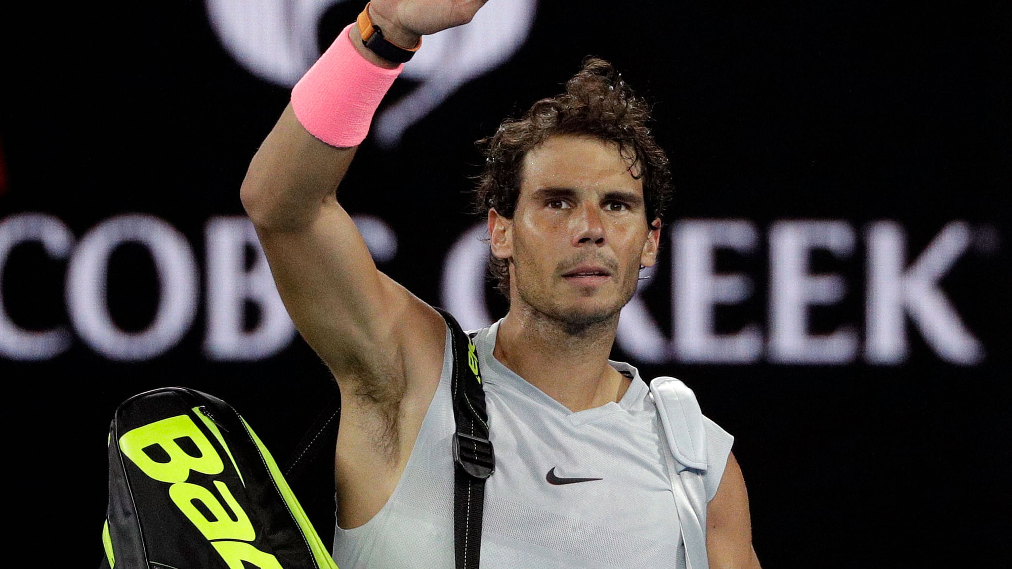 Rafael Nadal waves to the crowd after retiring hurt in the quarter-final match against Marin Cilic.