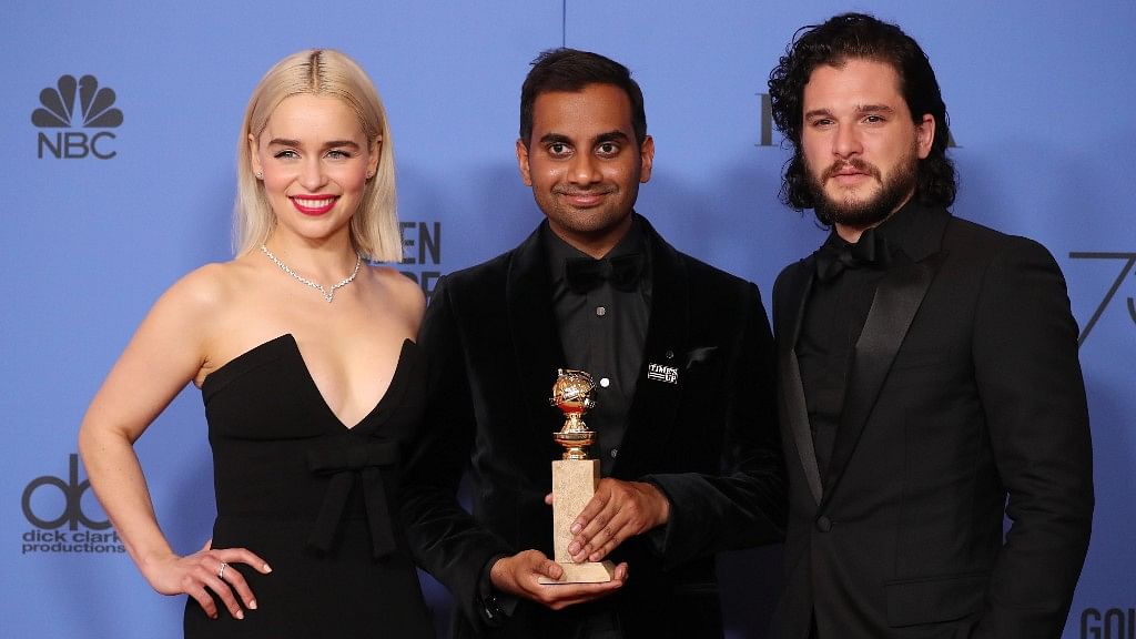 Presenters Emilia Clarke and Kit Harrington pose with Aziz Ansari backstage with his award for Best Performance by an Actor in a Television Series - Musical or Comedy for <i>Master of None</i>&nbsp;at the 75th Golden Globe Awards.