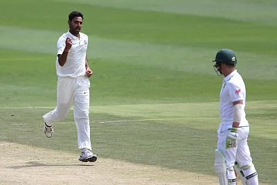 Johannesburg: Bhuvneshwar Kumar of India celebrates fall of Dean Elgar
