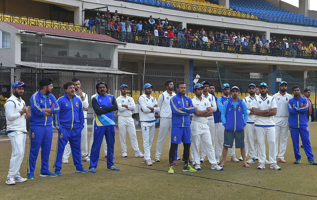Delhi players during the presentation ceremony of the Ranji Trophy final cricket match against Delhi, in Indore on Monday. 
