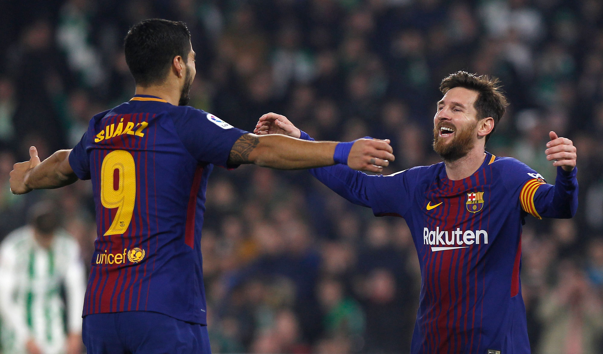 File picture of Barcelona stars Lionel Messi and Luis Suarez celebrating during a La Liga game against Real Betis.